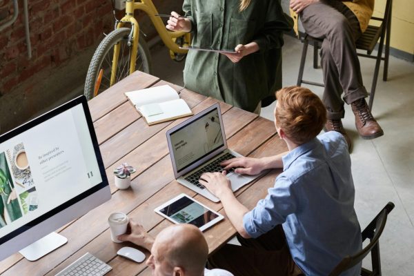 Casual workspace with diverse team working and interacting in a modern office.