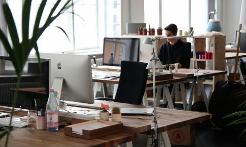 Open-plan office with modern decor and natural lighting, ideal for productivity.